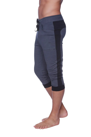 Mens cuffed yoga pants in charcoal with black featuring a drawstring waistband side panels and ribbed cuffs