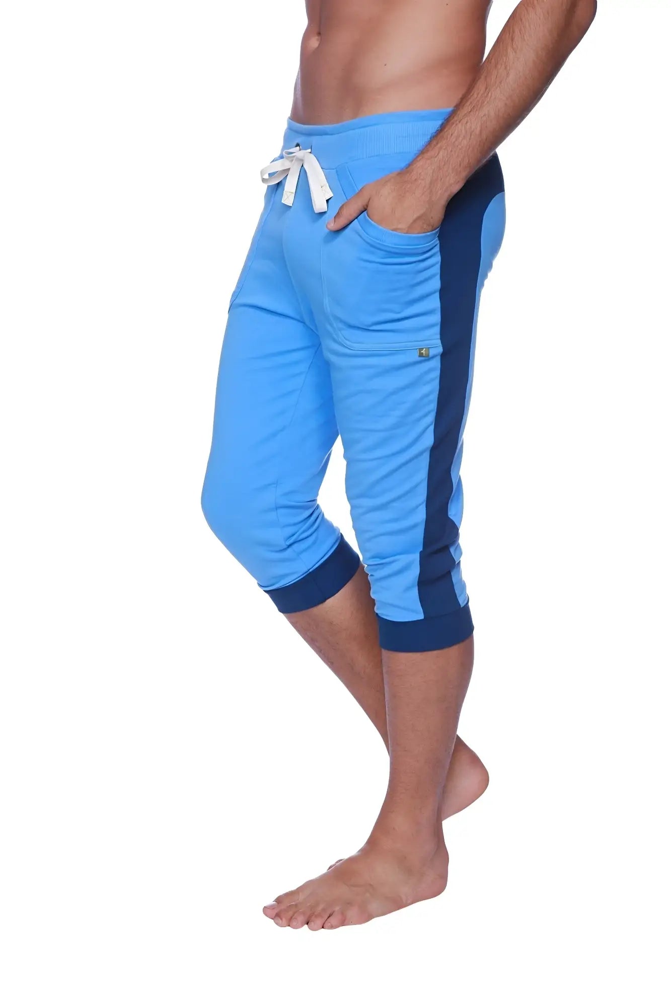 Mens cuffed yoga pants in ice blue with royal blue cuffs and a white drawstring waistband for athletic wear