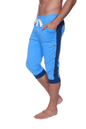Mens cuffed yoga pants in ice blue with royal blue cuffs and a white drawstring waistband for athletic wear