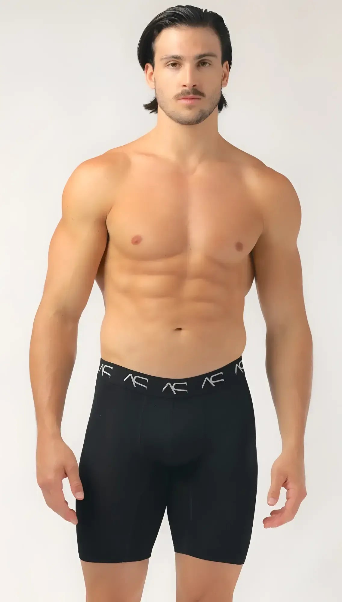 Black ac brand menâs mesh long trunks compression shorts with snug fit and white logo trim on waistband