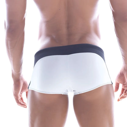 White swim trunks with navy blue waistband and trim from MetroMaleWear Arc Swim Boxer 4925-00 for comfortable swimming