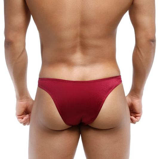 A sleek deep red thong made of smooth stretchy fabric with subtle sheen metro malewear bulge capri bikini wine 6104-29
