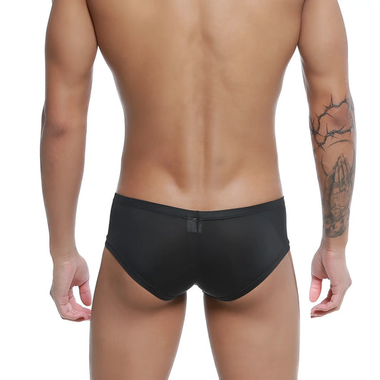 Black form-fitting swim trunks with subtle sheen and small rectangular tag on back waistband metro male wear cannon boxer