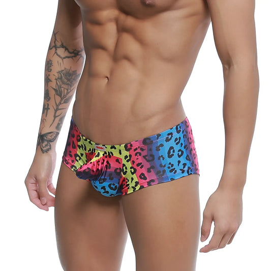 MetroMaleWear cannon boxer neon swim trunks with vibrant multicolored leopard print and bold pink blue yellow gradient design