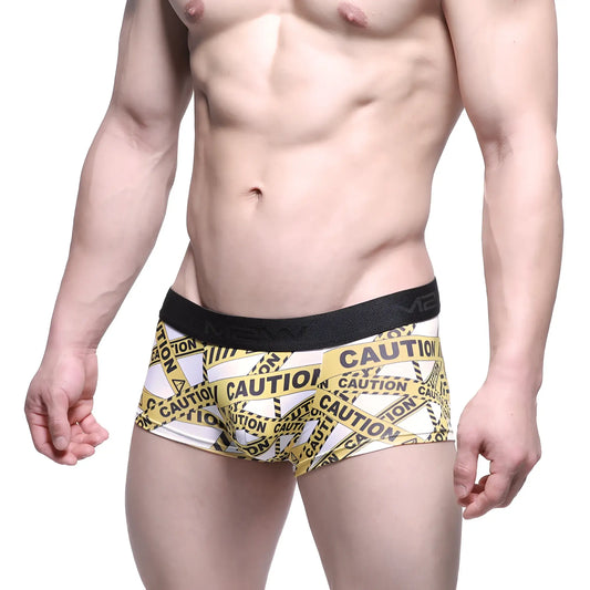 White boxer briefs with bold yellow and black caution tape pattern and black elastic waistband metroMaleWear 2026-69