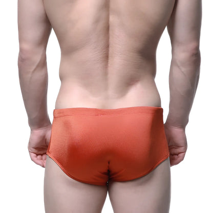 Metro male wear charlie swim brief in ochre orange with smooth slightly shiny fabric finish for swimming