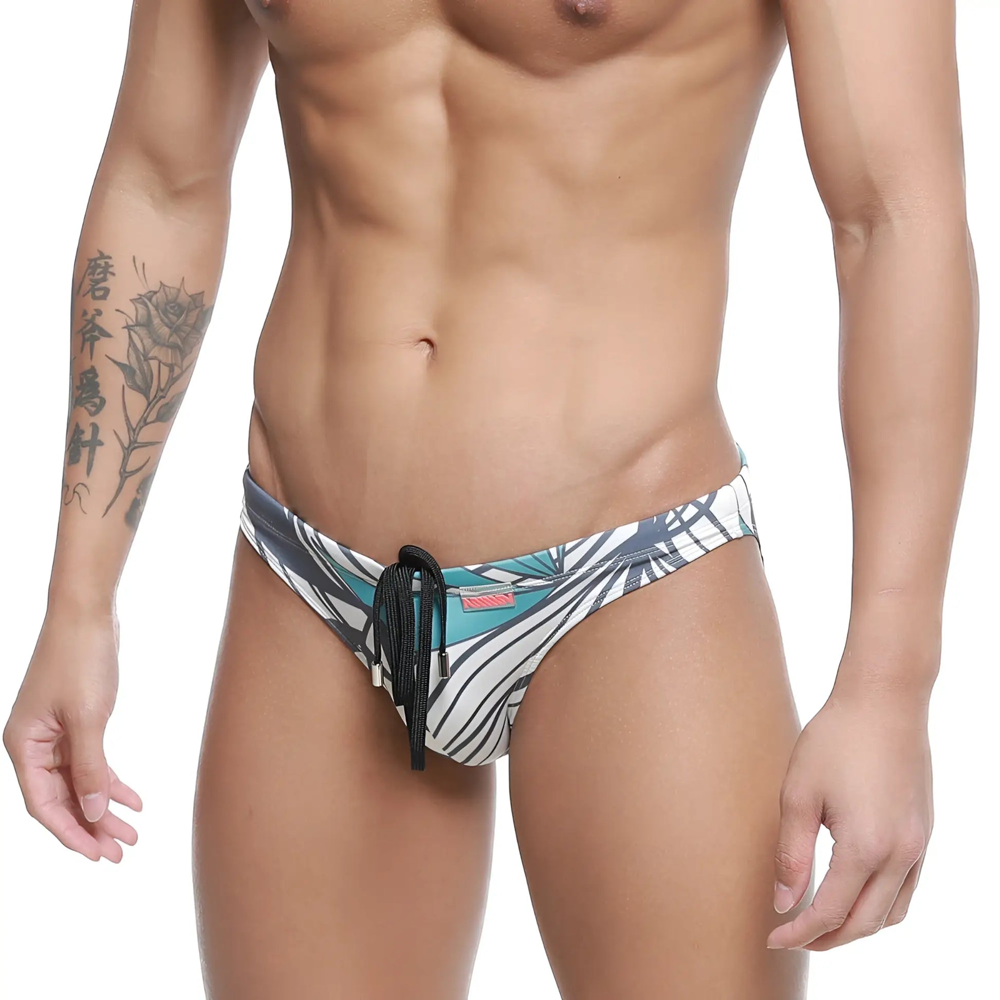 MetroMalewear classic swim bikini meadow 4937-09 men’s swim trunks with bold teal black white tropical leaf pattern and black drawstring