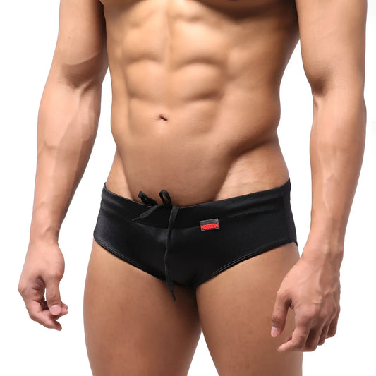 MetroMaleWear classic black swim brief with drawstring waistband and small red logo on the side
