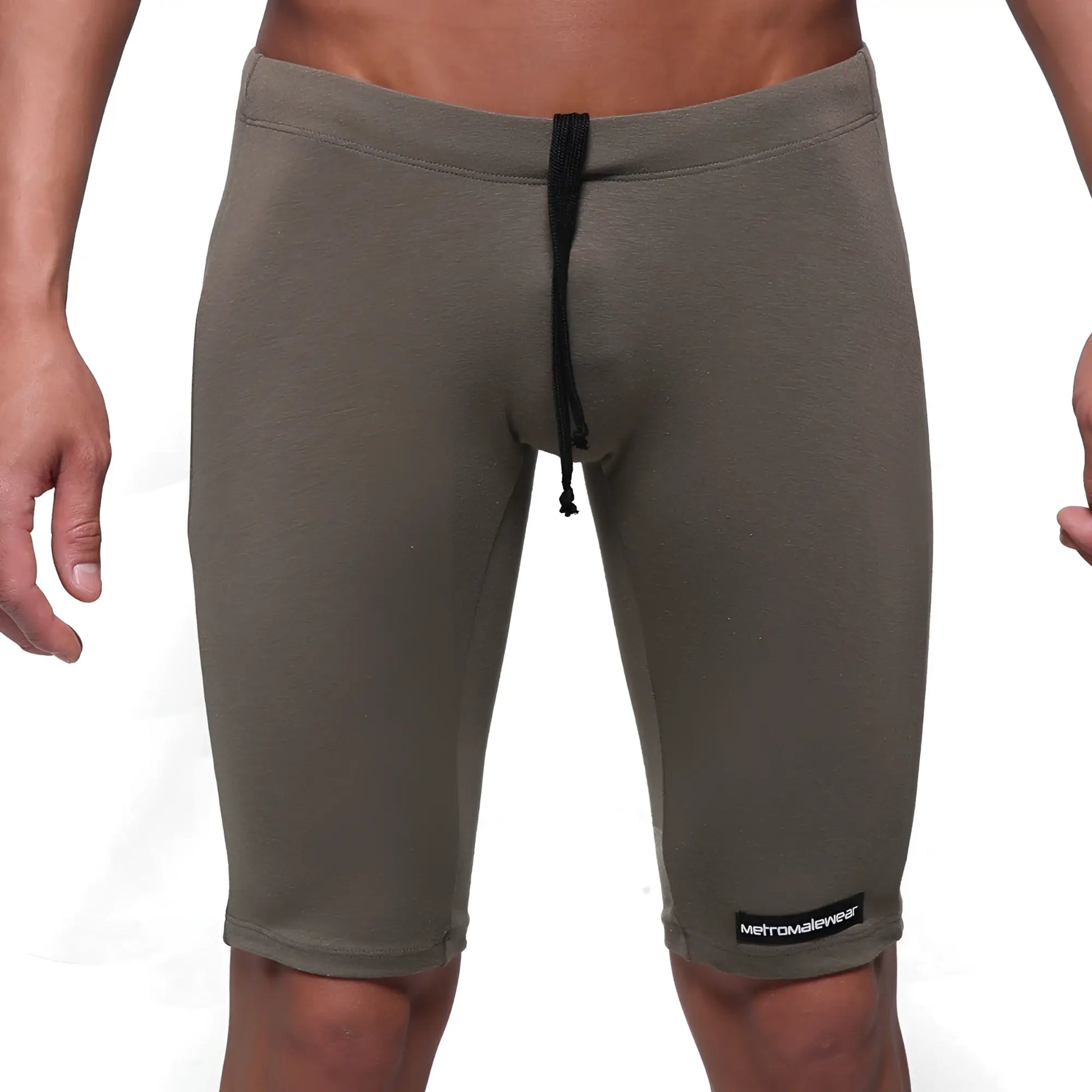 Olive green cotton athletic shorts with black drawstring and metromalewear logo patch on lower right leg