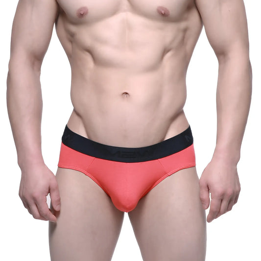 Coral cotton metro malewear hip briefs with black elastic waistband featuring the mev logo for comfortable daily wear
