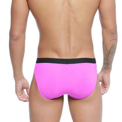 Bright pink MetroMaleWear Expose brief with black elastic waistband designed for comfortable daily wear