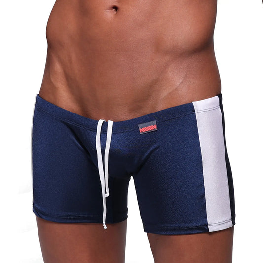 Navy blue MetroMaleWear Extreme Square swim trunks with white side stripes and matching drawstring waistband