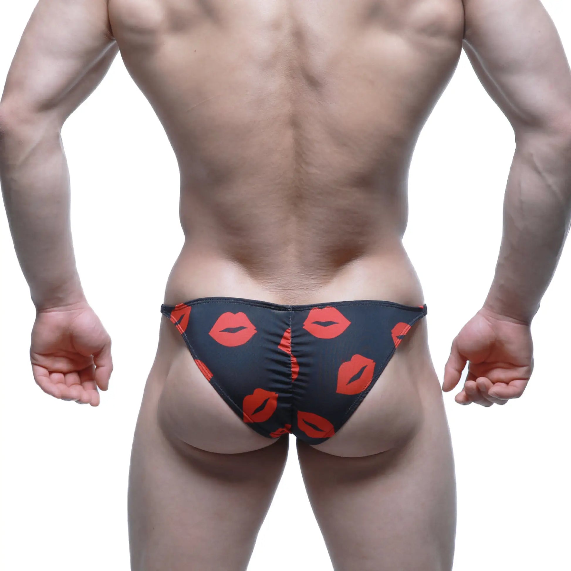 Black MetroMaleWear Fantasy Bikini Kiss 6116-62 swim trunks with bold red lipstick print pattern