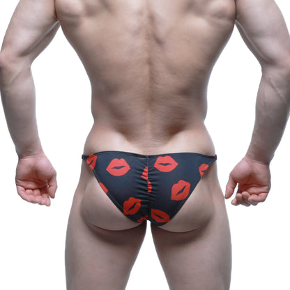 Black MetroMaleWear Fantasy Bikini Kiss 6116-62 swim trunks with bold red lipstick print pattern