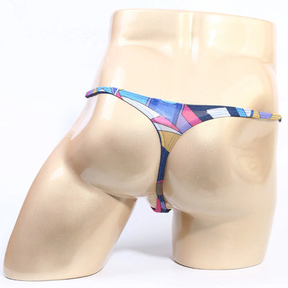 A vibrant geometric-patterned MetroMaleWear Fantasy Thong Picasso 6112-87 in blue pink and yellow with thin elastic waistband