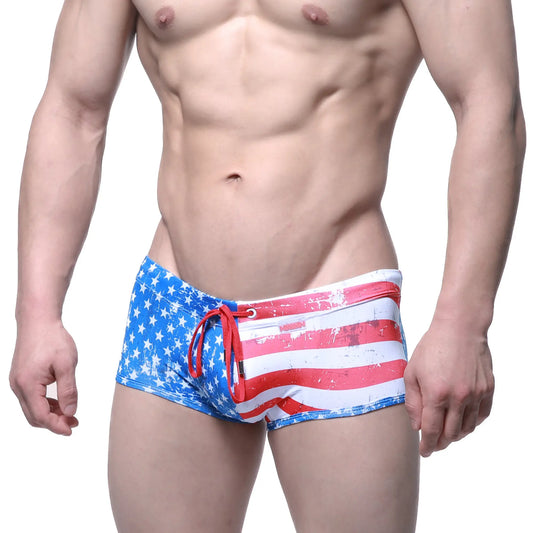 MetroMaleWear flag swim trunk 4938-91 features blue and red american flag pattern with white stripes and a red drawstring
