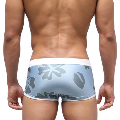 Light blue MetroMaleWear Fresco swim trunk briefs with gray floral pattern and white trim for natural comfort