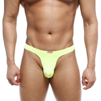 Bright neon green MetroMaleWear Fria thong with a small red and white brand tag at the waistband front view