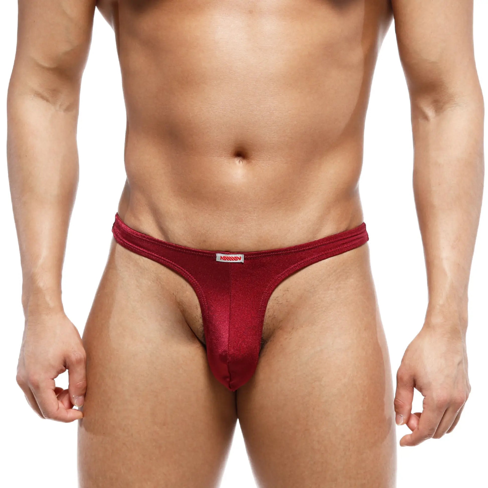 A sleek deep red metroMalewear fria thong made of smooth stretchy fabric with a subtle sheen and white brand tag