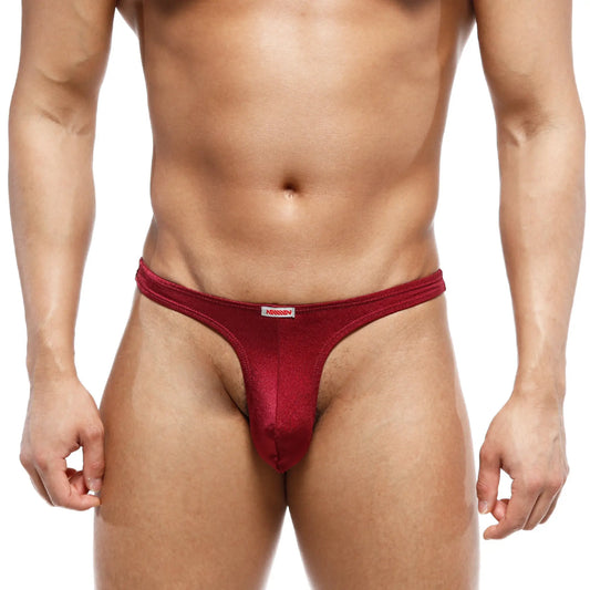 A sleek deep red metroMalewear fria thong made of smooth stretchy fabric with a subtle sheen and white brand tag