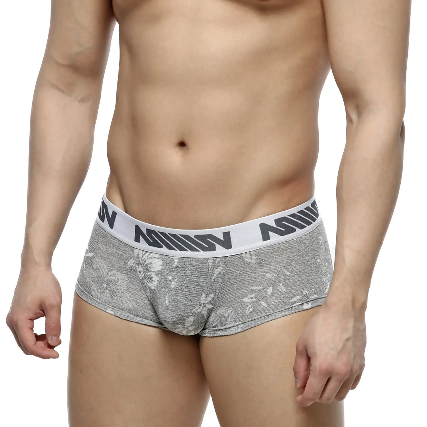 Gray floral-patterned jacquard briefs with white elastic waistband featuring black nomin lettering by metromalewear