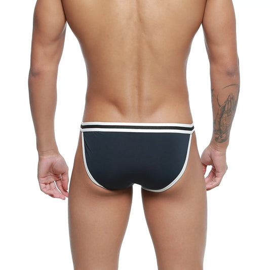 MetroMaleWear link bikini swim trunks in dark blue with white trim featuring a sleek modern design