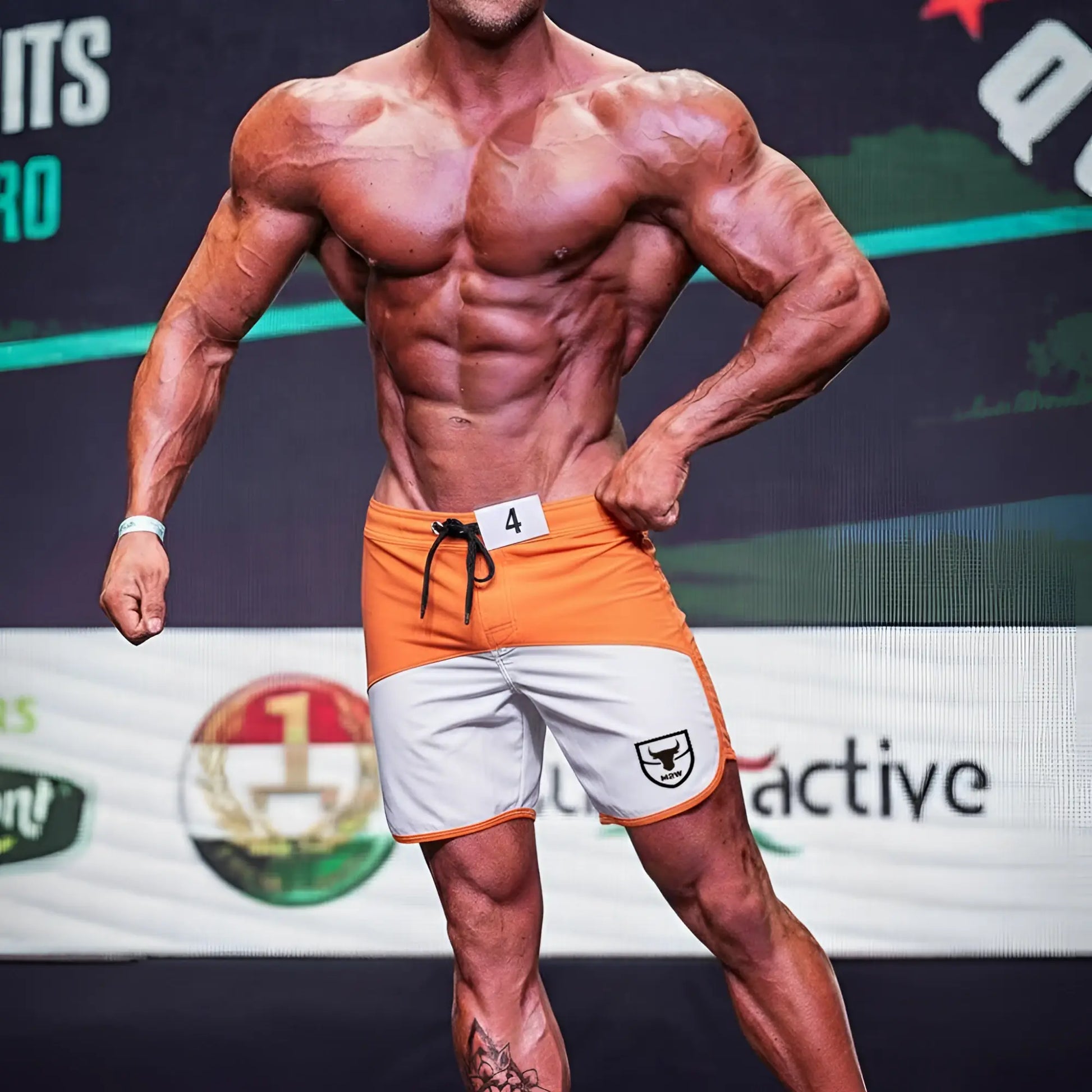 Metro malewear cordoba physique board short orange with white accents black drawstring and shield logo on side