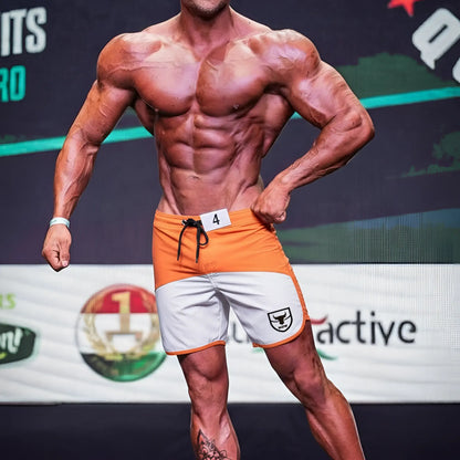 Metro malewear cordoba physique board short orange with white accents black drawstring and shield logo on side