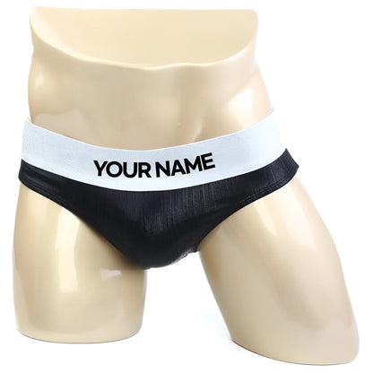 Black mesh briefs with white elastic waistband featuring bold your name text from metromalewear diy competition suit