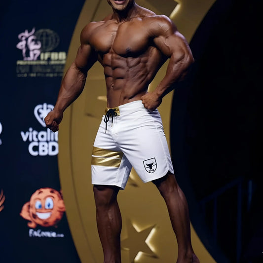 White athletic shorts with gold stripe and black drawstring featuring small shield logo on left leg by metromalewear