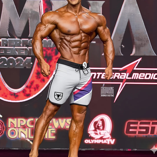 Gray metromale wear ifbb pro mens physique board short with black trim purple pink stripe and white bull logo