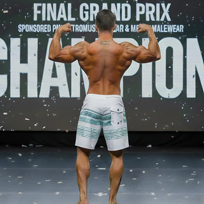 White board shorts with teal horizontal stripes and a back pocket from the MetroMaleWear Innocent Physique collection.