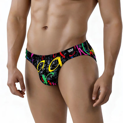 Black swim trunks by metromalewear with neon pink yellow green and red graffiti style graphic vibrant colors
