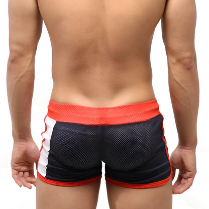 Black and red metroMalewear punch navy 4709-28 mesh athletic shorts with white side stripes and orange waistband