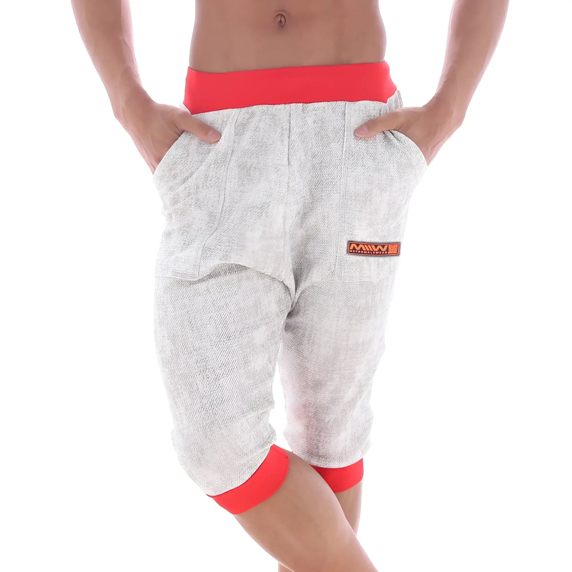 Gray heathered capri pants with red elastic waistband and cuffs featuring an orange Metro Malewear logo patch.
