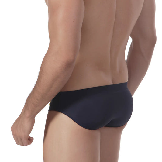 Navy blue MetroMaleWear Scottish swim brief with small gold logo on left hipband designed for swimming