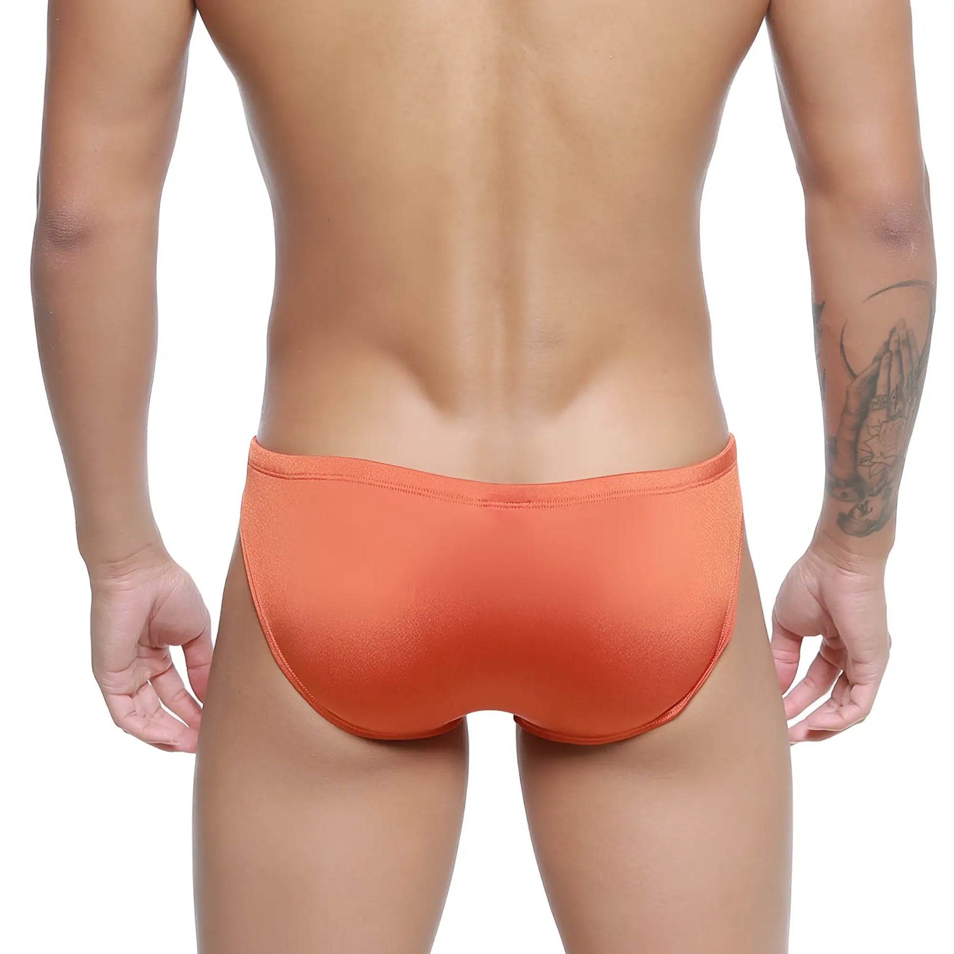 Orange textured silicon swim briefs by metro malewear in ochre designed for swimming and beachwear