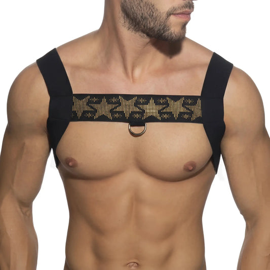 Black shoulder harness with gold embossed star pattern and central metal ring from metromalewear stars harness 1400-40