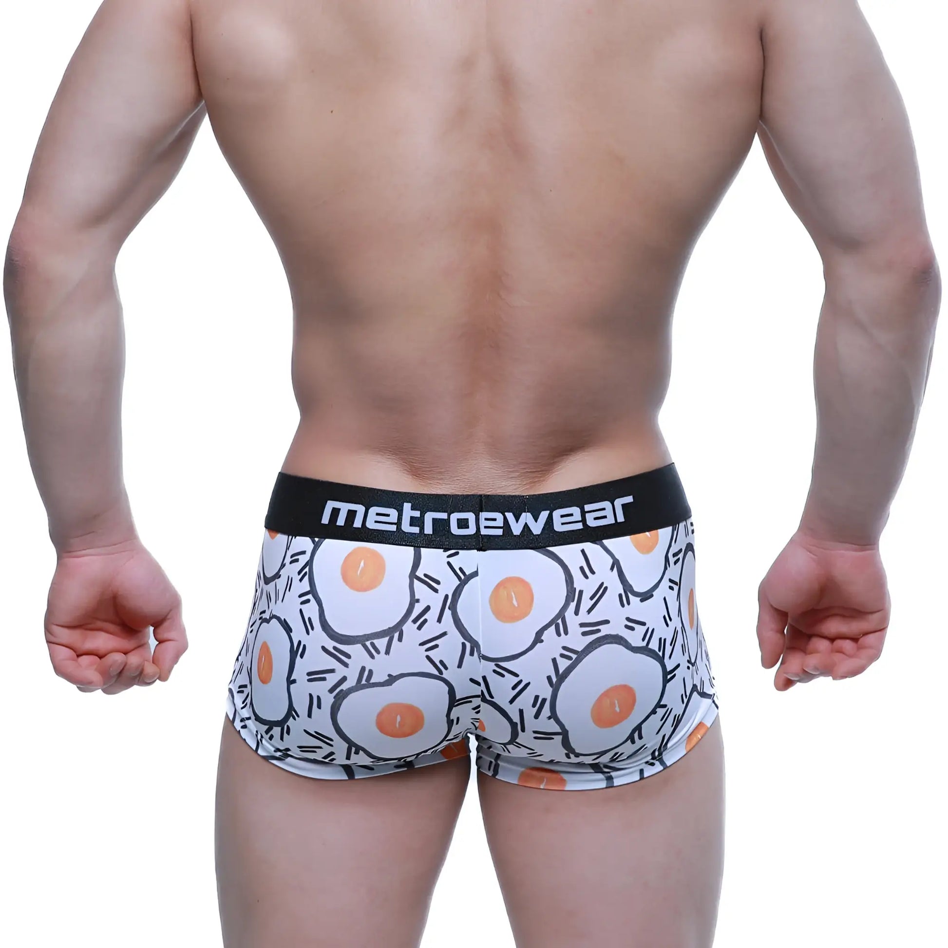 White boxer briefs with a cartoon fried egg pattern and a black logo waistband, MetroMaleWear Sunny Side Short Boxer.