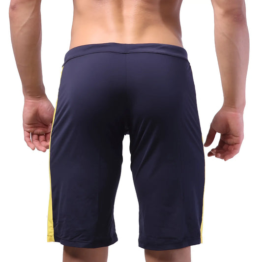 Navy blue athletic shorts with yellow side stripes from metromalewear trainer short 4713-28 for sports and training