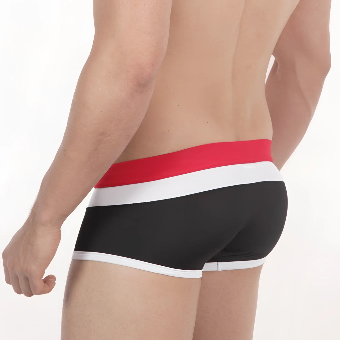 Black metro male wear briefs with bold red and white striped waistband featured in trio swim trunk style