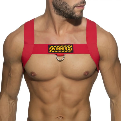 Red fabric MetroMaleWear WINNING harness with yellow and black patch and metal ring for secure fit and style