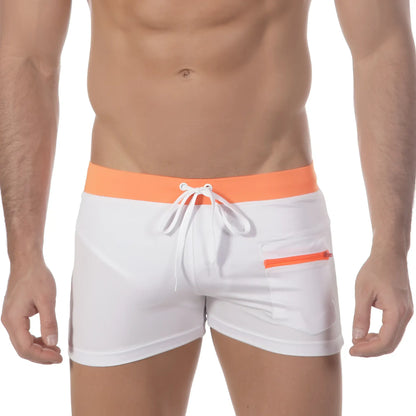 White swim trunks with bright orange waistband and zipper pocket featuring white drawstrings metroMalewear zipper swim boxer