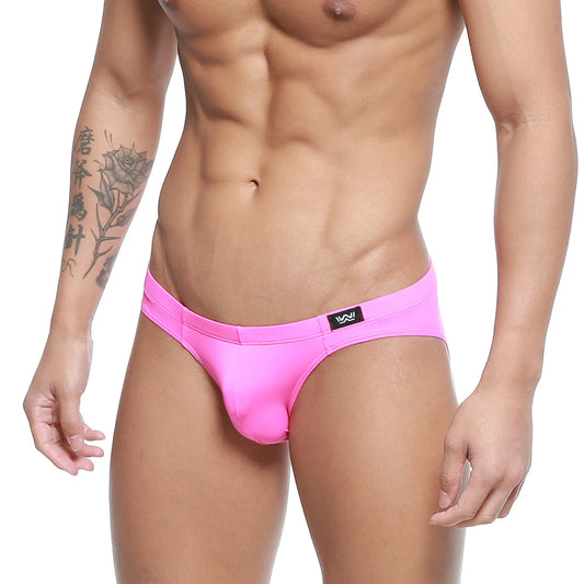 Bright pink sleek form-fitting briefs with black logo tag on waistband MetroMaleWear Magenta Bikini 5103-58