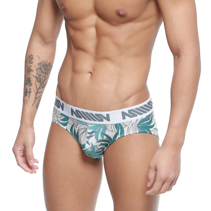 White briefs with green and gray tropical leaf pattern and anis waistband from metromalewear meadow hip brief 5003-56