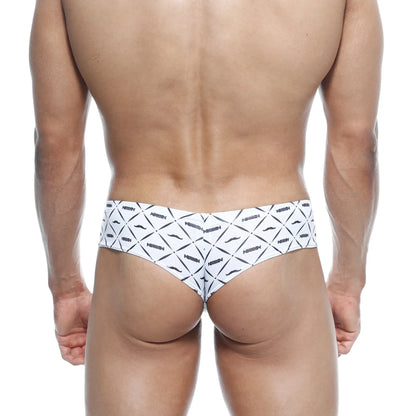 White briefs with bold black geometric and mustache pattern featuring repeated arrow branding metro malewear micro cheek caballero 2027 03