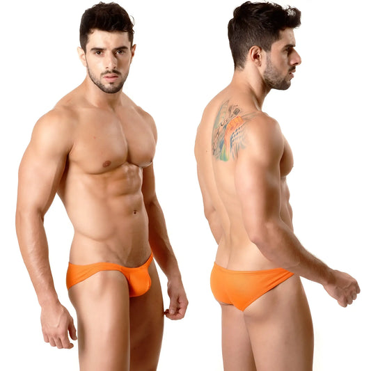 Bright orange form-fitting MetroMaleWear Minimo Hip Brief swim trunks with smooth metallic fabric finish