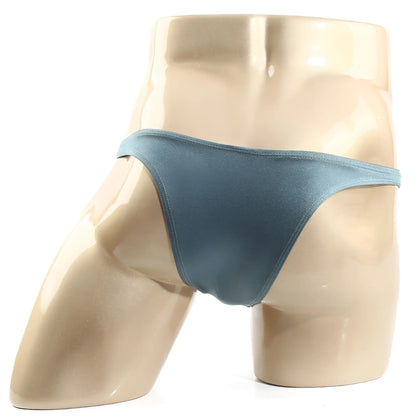 A sleek matte teal thong from metromalewear monaco bikini moss 6010-17 made of smooth fabric with a minimalist design