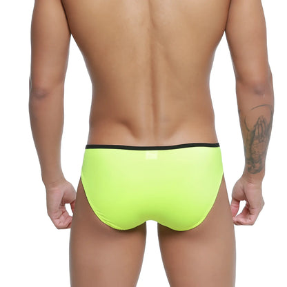 Bright neon green swim trunks with black waistband from metromalewear over-limit bikini for comfortable swimming