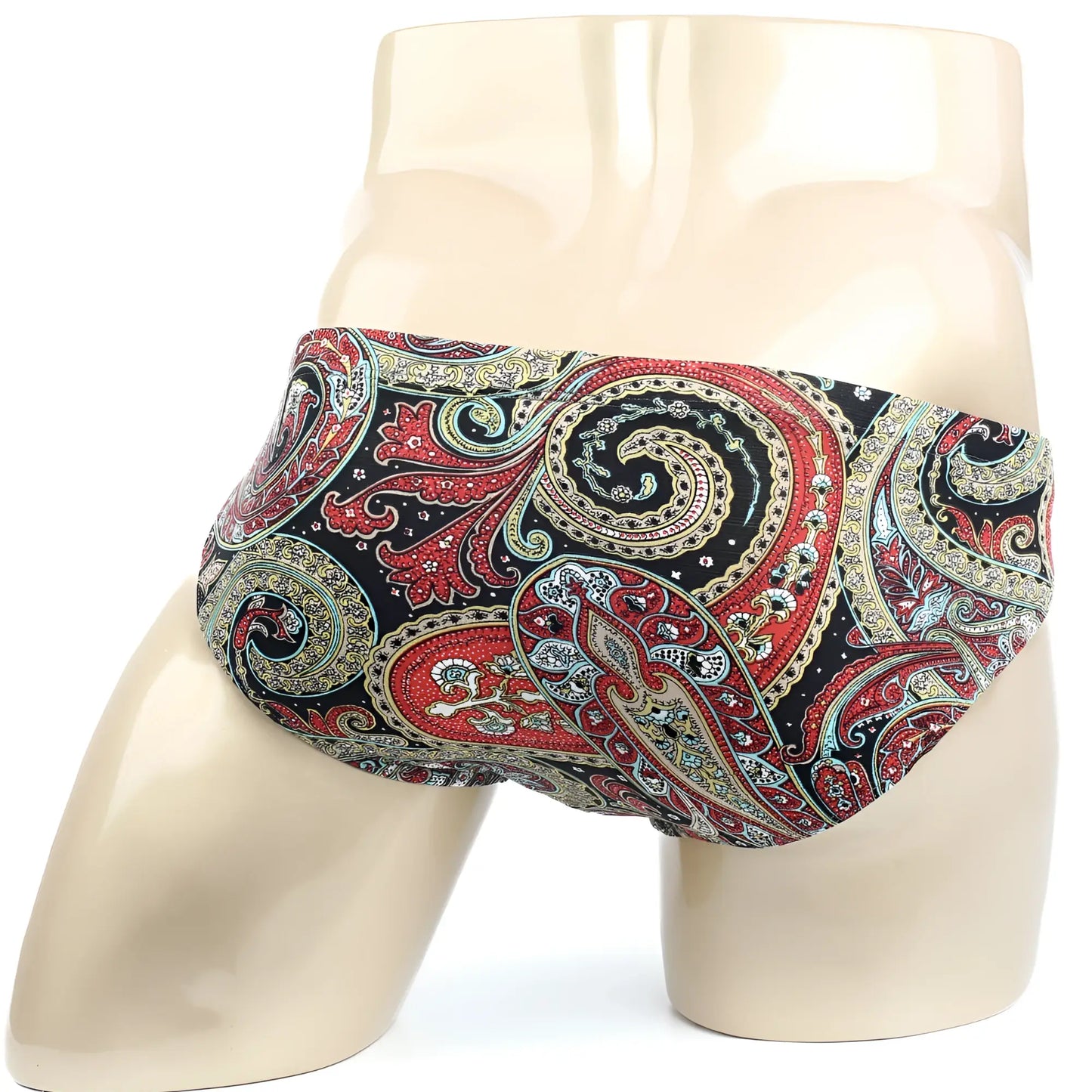 Vibrant red gold and teal paisley pattern men’s briefs by MetroMaleWear displayed on a mannequin